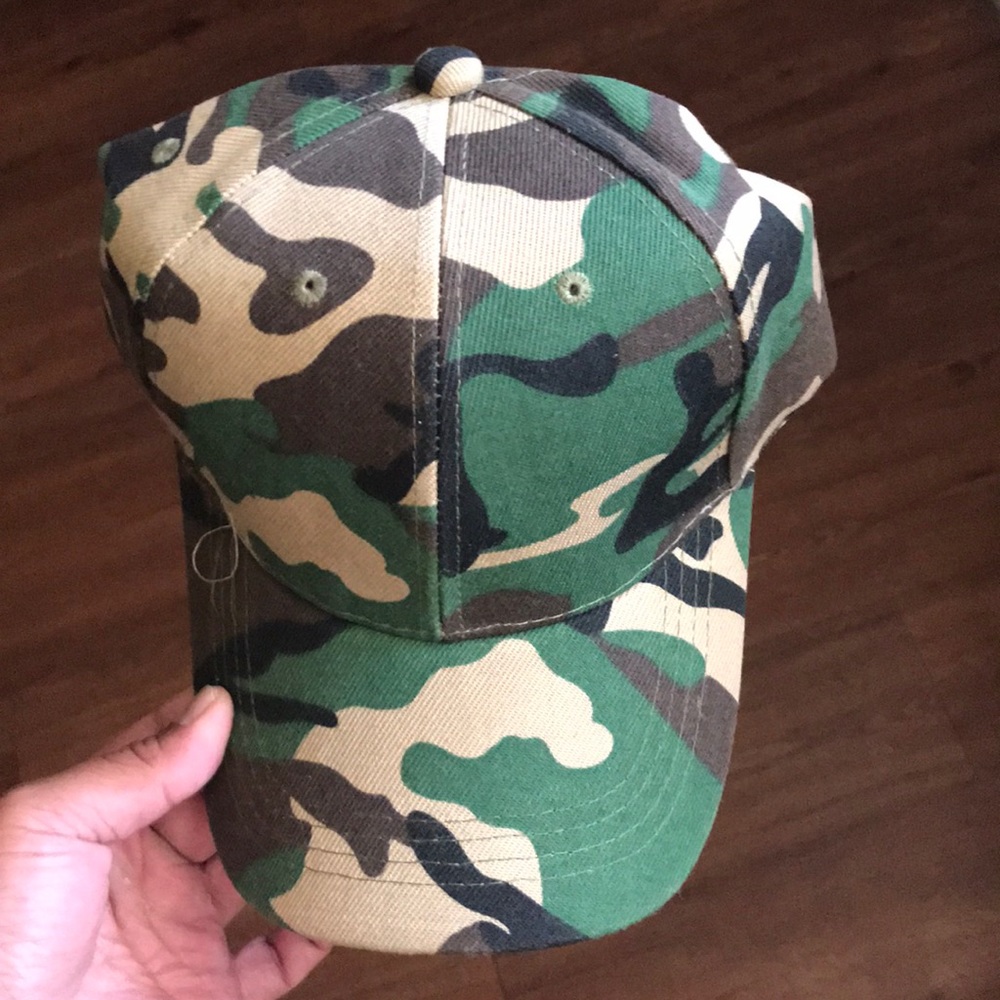 Brand new camo hat never worn, made in Bangladesh.